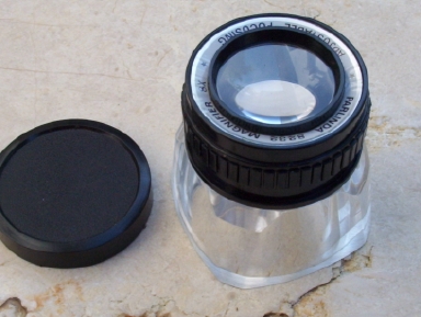 Adjustable lens  magnifier. Great for jewelers, photographers, printer, stamp & coin collectors 